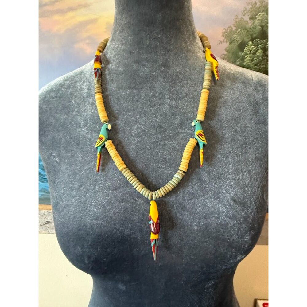 wooden vintage statement handmade piece featuring colorful carved parrot